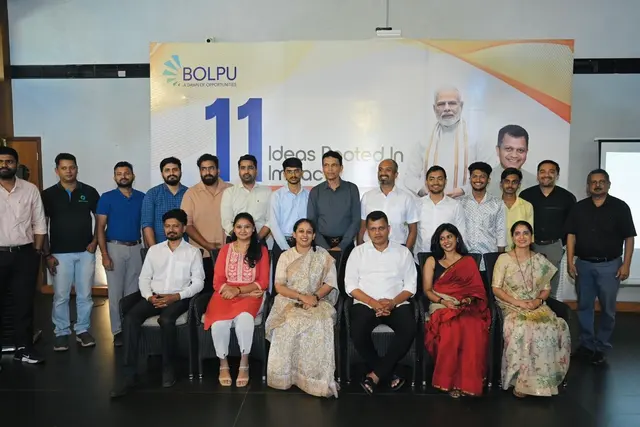 Group photograph of the eleven Bolpu 2.0 winning teams in front of a Bolpu banner.